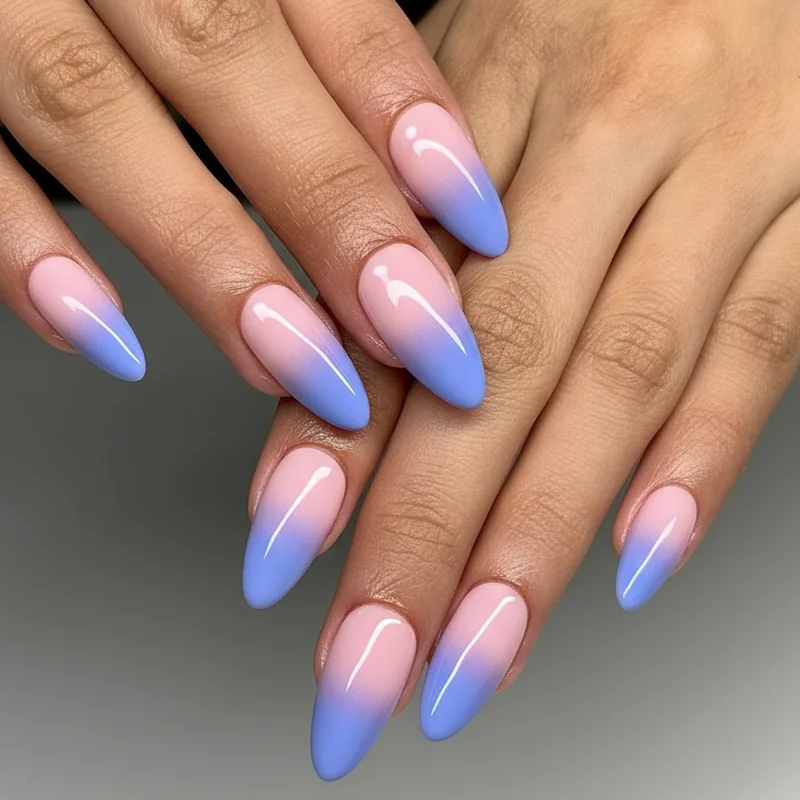 Bi flag ombre nails showing pink to purple to blue gradient achieved with sponge blending technique across all ten nails in close up detail