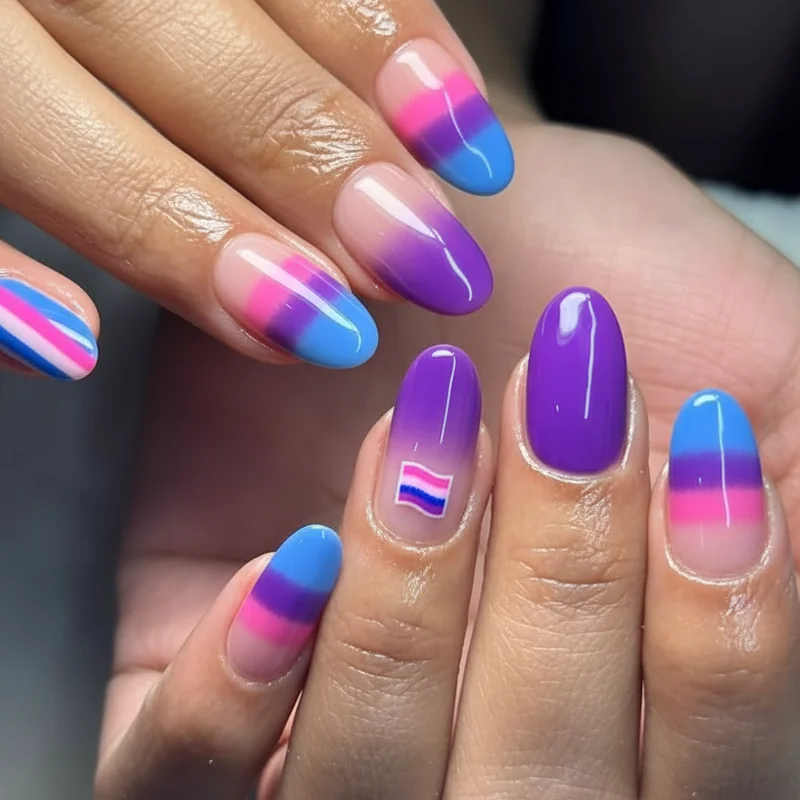 Bisexual nail designs showing variety of formats including full stripe set ombre gradient and single accent nail in pink purple blue palette