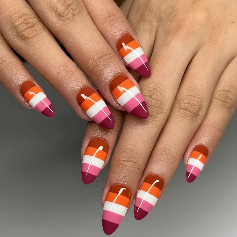 Classic lesbian flag horizontal stripe nails showing clean sharp stripe edges achieved with striping tape on almond and coffin nail shapes