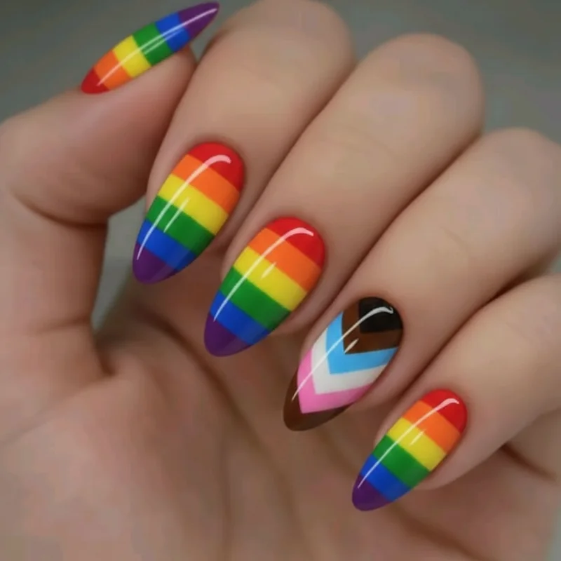 Rainbow and progress pride flag nail comparison showing six stripe rainbow versus eleven colour chevron progress design side by side