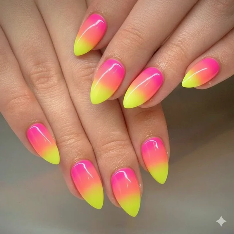 Neon rainbow ombre nails in electric coral hot magenta and acid yellow bold bright gradient for pride parade season 2026