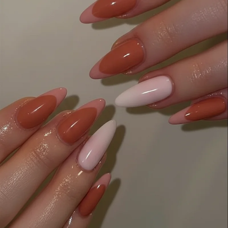 Lesbian flag palette showing muted orange dusty pink and white subtle nail shades arranged for everyday wearable minimalist manicure