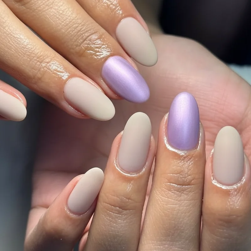 Work safe enby nail designs showing matte white neutral base with single accent and satin purple finish for subtle nonbinary pride in professional settings