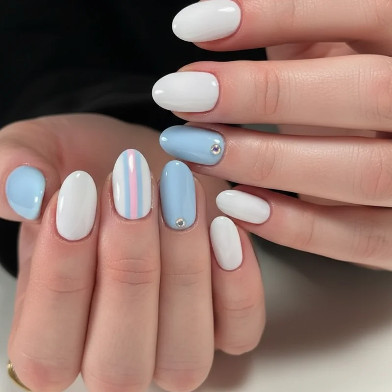 Subtle trans pride acrylic nails showing pastel blue single accent design on almond shape for everyday and work appropriate wear
