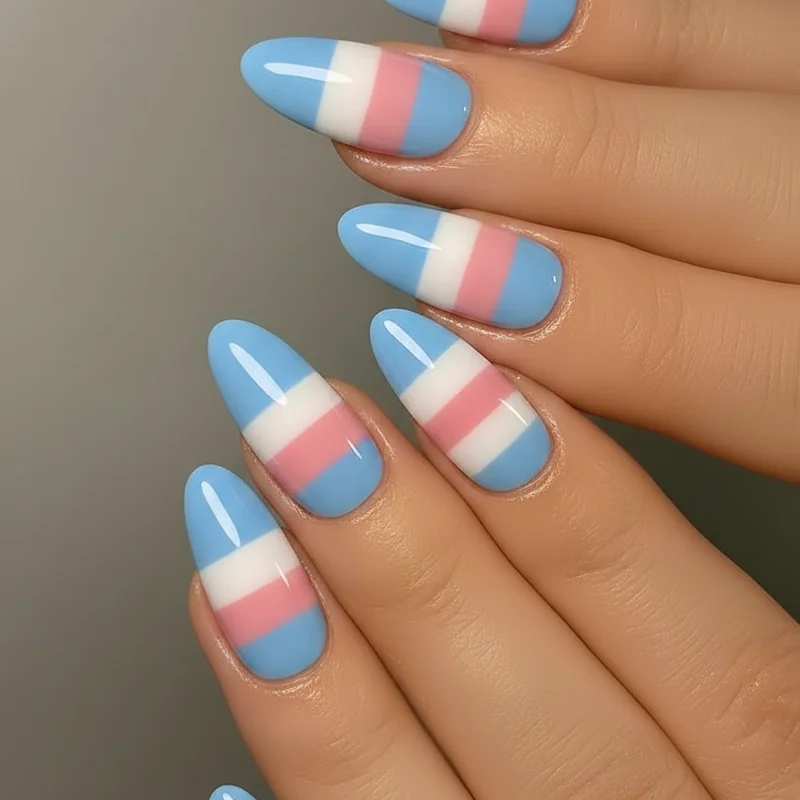 Trans flag nail colour order showing light blue dusty pink and white polish swatches in correct five stripe sequence on natural nails