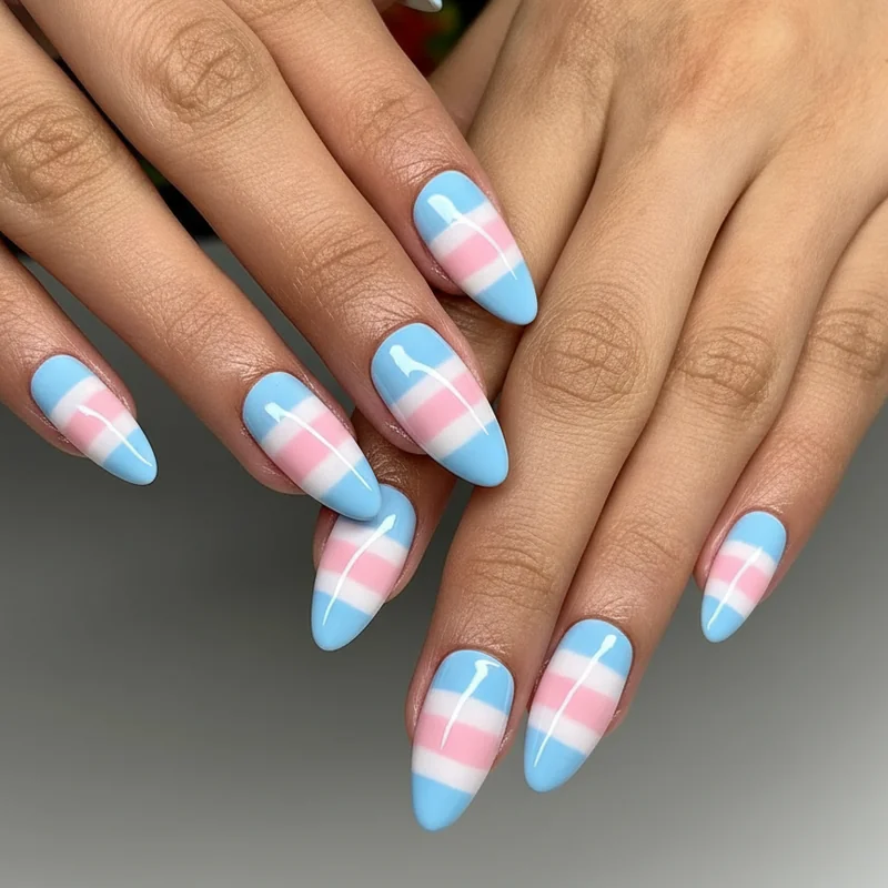 Trans flag nail colours showing light blue baby pink and white polish swatches on nails demonstrating the transgender pride palette reference for 2026