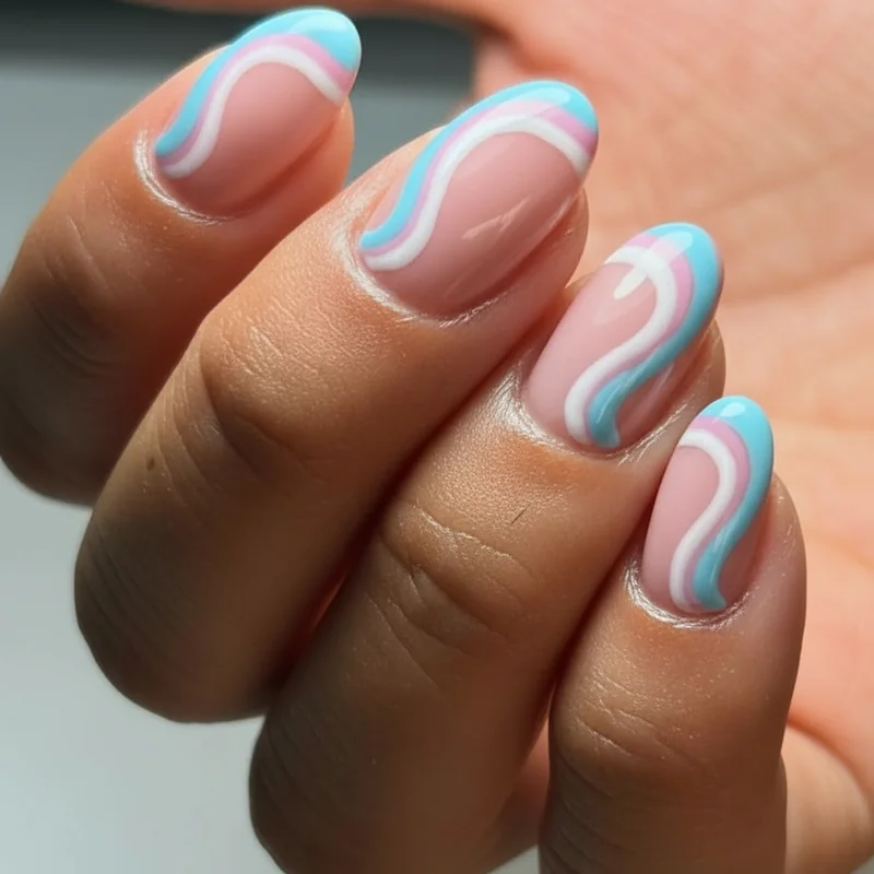 Trans French tip nails showing milky pink base with light blue swirl tips and gel liner smile line outline on medium oval nails for transgender pride 2026