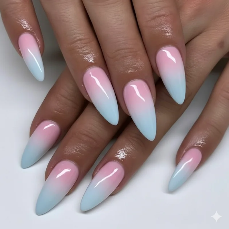 Trans ombre nails showing light blue blending through milky white into baby pink gradient on short oval nails with sponge blending and gel finish
