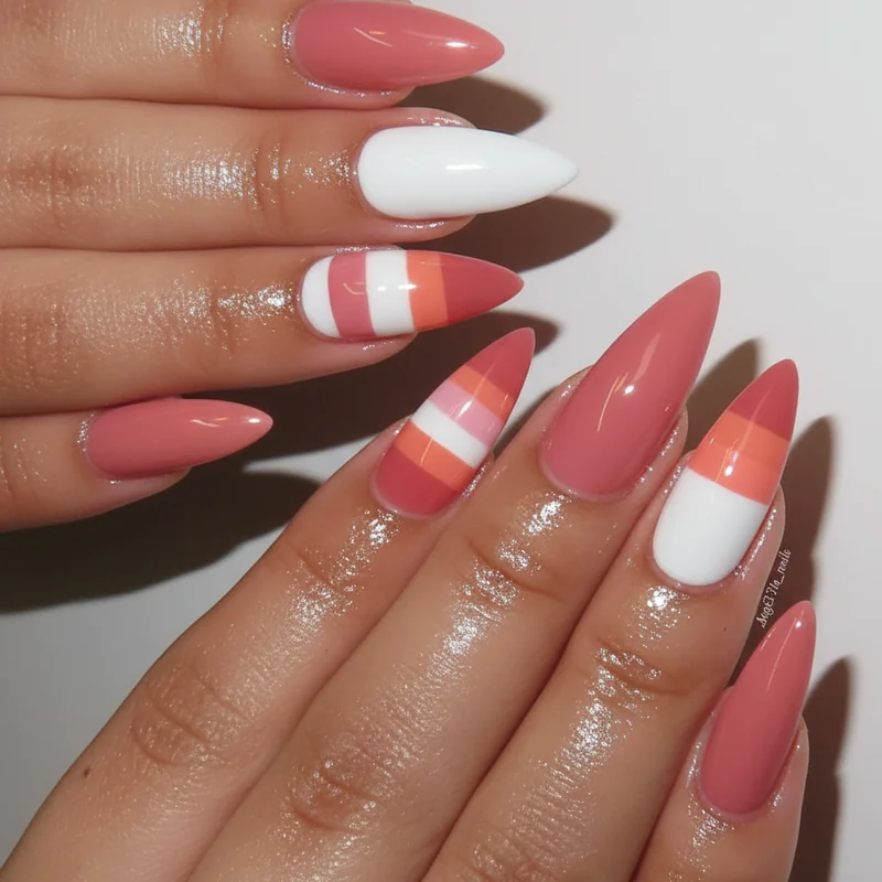 Femmicure nails queer manicure showing gel extensions on long fingers with two short index middle nails in matching nude pink shade