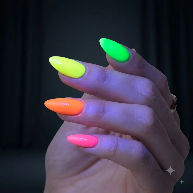 Lollapalooza nails in neon sunset ombré pink to orange to yellow, shown in golden-hour festival lighting