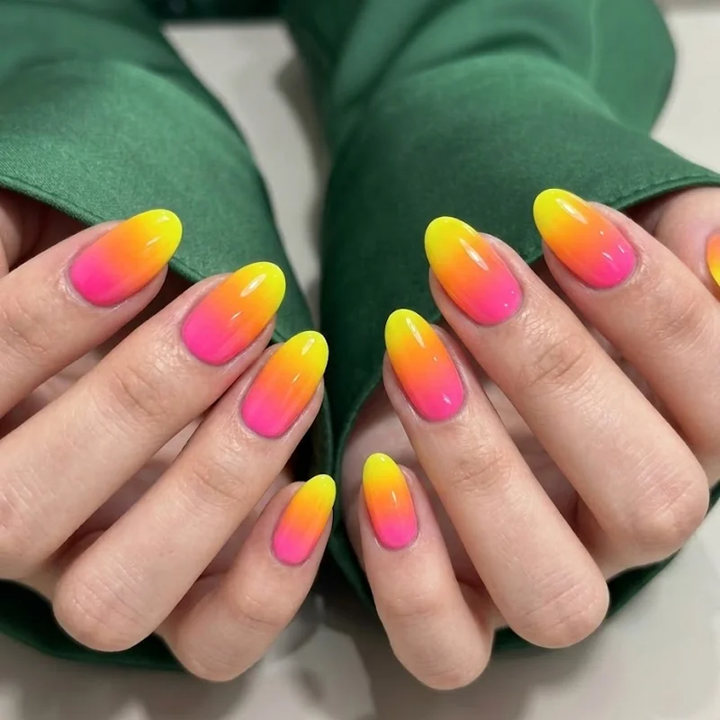 Lollapalooza nails with Y2K smiley face accent nail on bright solid base, short length, salon-finished look
