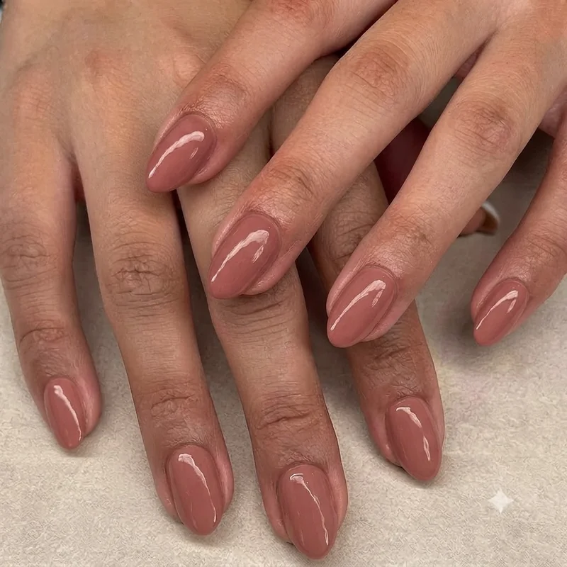Simple single colour long nails proving minimal design still reads as elevated on an almond shape
