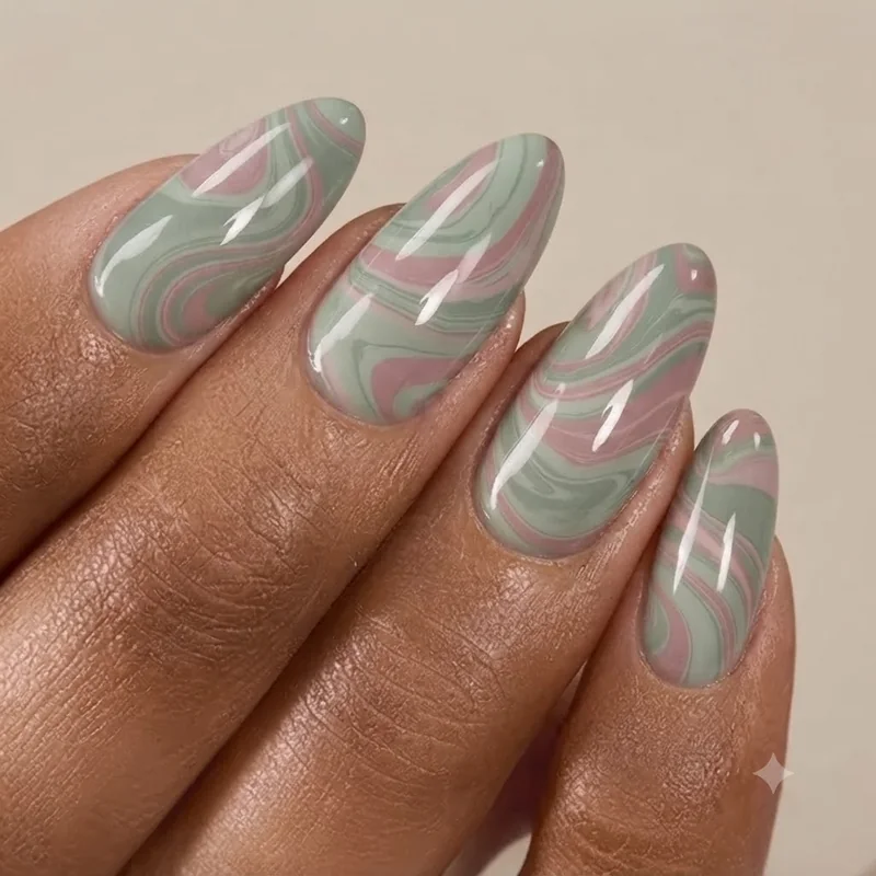 Finished water marble manicure showing a mid-toned two-colour swirl pattern with clean, tidy cuticle edges after cleanup