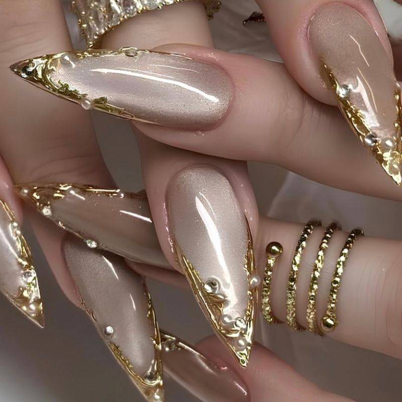 Maximalist goddess nails with multiple embellishments