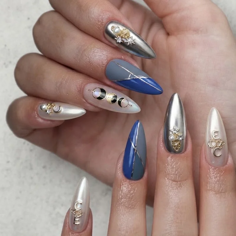 2026 maximalist nails trend with chrome finish, layered charms, and statement colour blocking