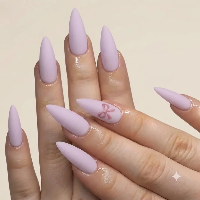 DIY Melanie Martinez nails at home with pastel base, matte top coat and hand-painted bow accent for beginners