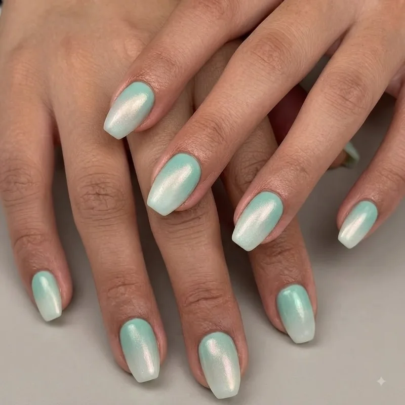 Mermaid nail designs in pastel seafoam ombré with soft opal shimmer top coat on coffin shape nails