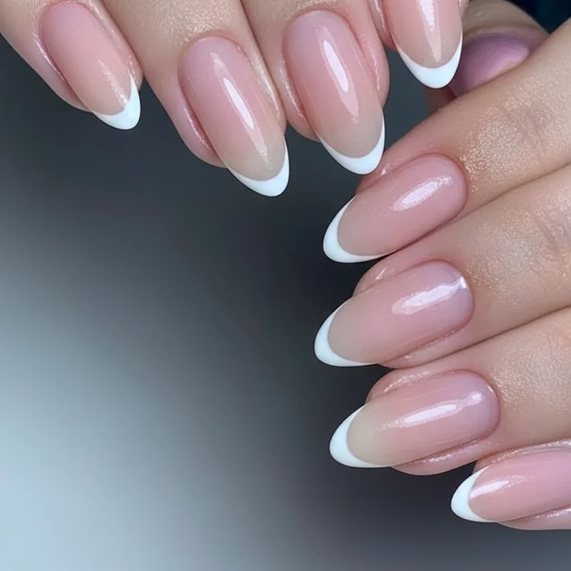 Liner brush stroke direction showing side-to-centre arc technique for consistent micro french tip smile line on natural nails