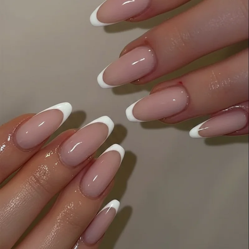 Micro french tip on short squoval nails showing 1mm white tip and the one-fifth nail bed width proportion rule for short nails
