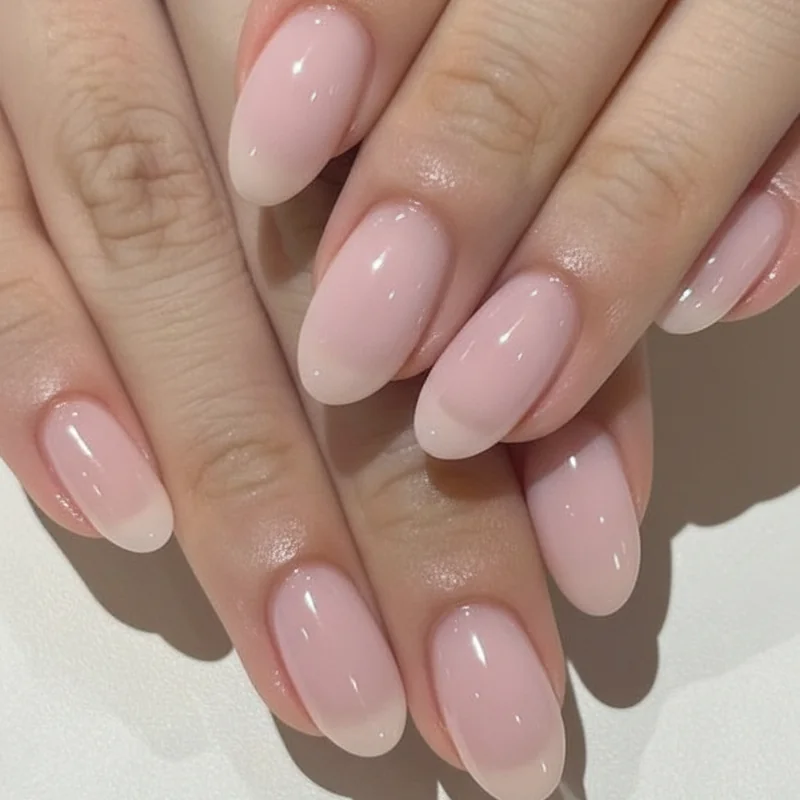 Milky pink nail polish buildable opacity showing one coat sheer versus two coats semi-opaque versus three coats full milky finish depth