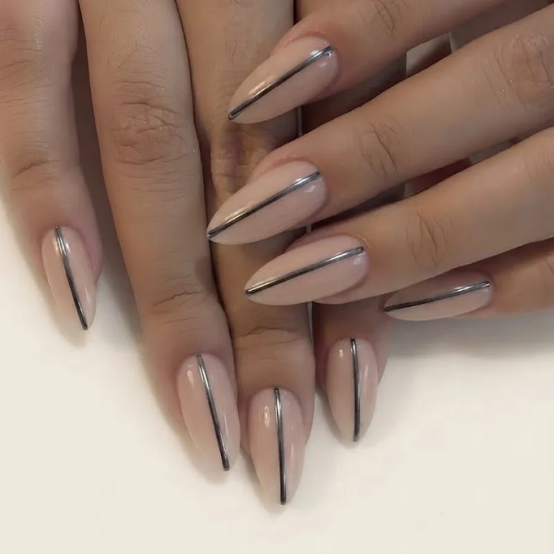 Geometric line nail designs with criss-cross pattern detail on a single accent nail