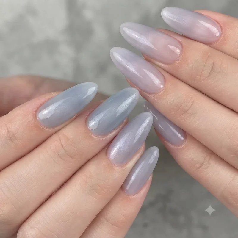 Strawberry milk nails shown in a sheer pink glossy finish with soft translucent colour and rounded shape