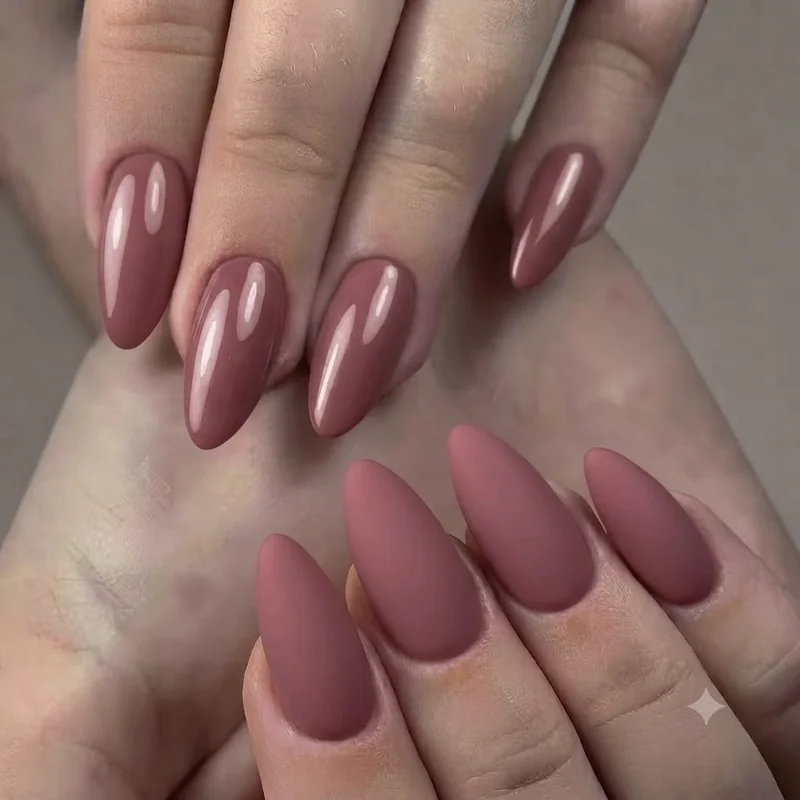 Almond shape one color nails in a warm shade, elongated manicure silhouette