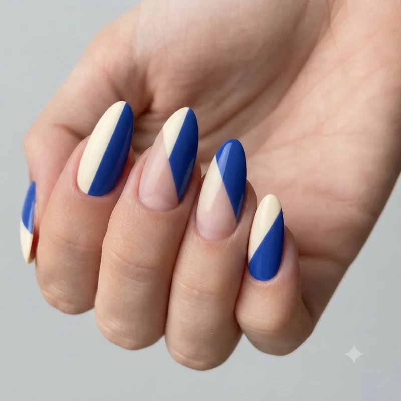 Color block nail art idea dividing the nail into solid, angled sections, a graphic modern take on abstract manicure design