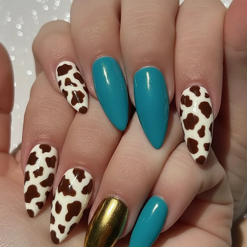 Press on western nails showing cow print chrome tip and turquoise colour block sets prepared for country concert same day application