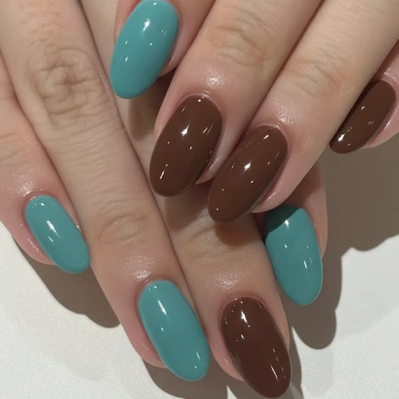 Turquoise and brown western nails showing muted robin egg blue and warm chocolate colour block combination for country concert wear