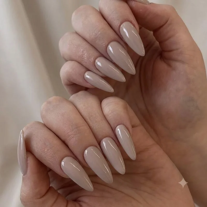 Neutral versatile manicure styled with accessories showing what nail color goes with everything