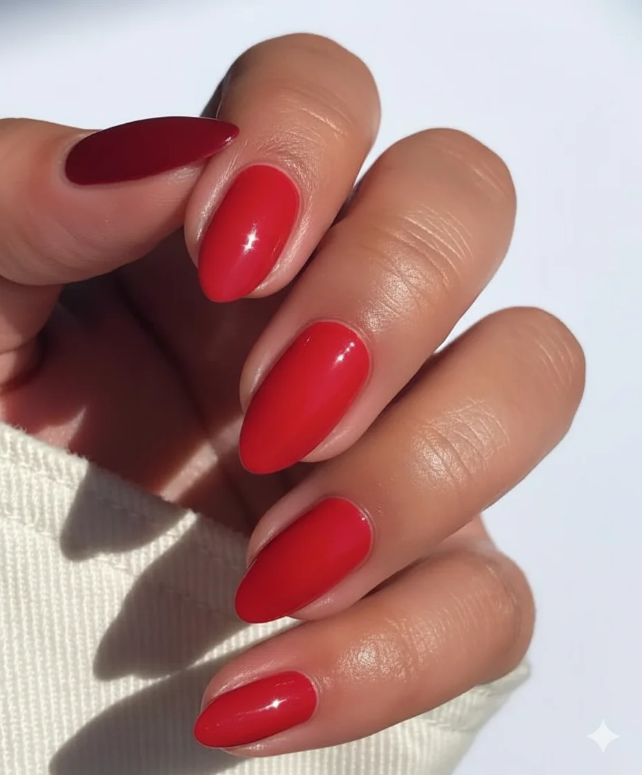 Red nail polish shade range showing classic berry tomato and deep rose variations suitable for Mother