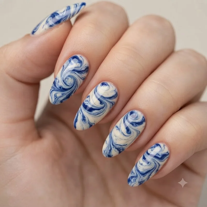 Marble nail art design created using a toothpick swirl technique for beginners