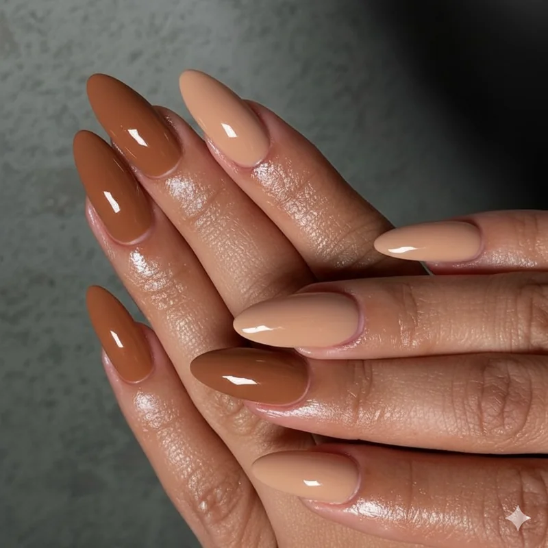 Earth tone nail colors for blondes featuring latte taupe caramel and warm brown shades against golden honey and warm blonde hair