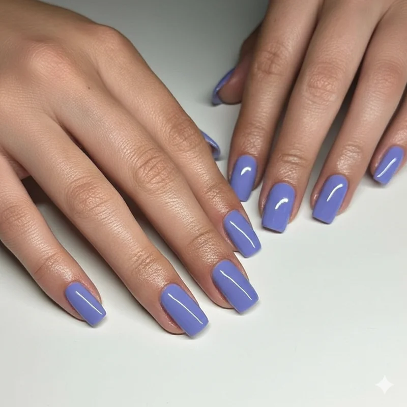 Periwinkle nail color on cool blonde with blue eyes showing blue purple grey shade contrast against platinum hair and fair skin