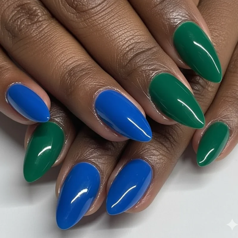 Bold jewel tone nail colors on dark skin including cobalt blue emerald green and fuchsia pink showing high contrast vibrant manicure