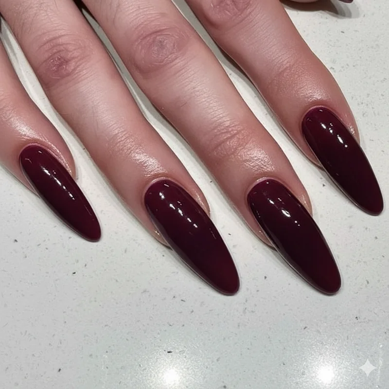 Berry plum burgundy and wine nail swatches on fair to medium redhead skin ideal for auburn and deep red hair