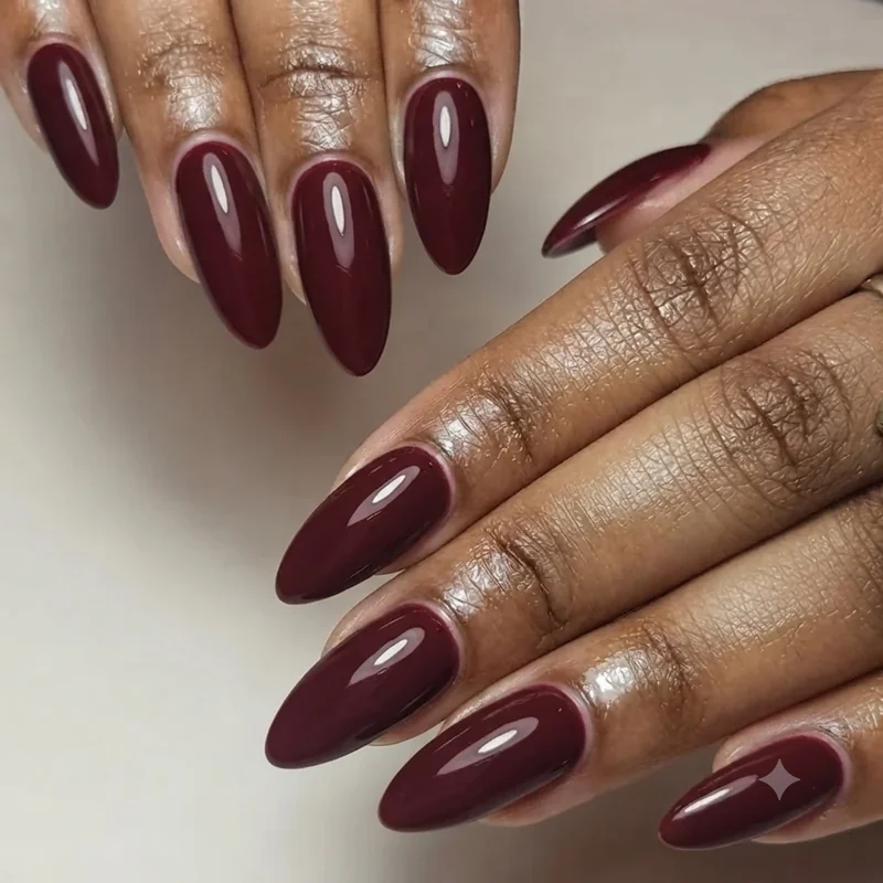 Close up of almond nail shape manicure showing tapered sides and rounded elongated tip
