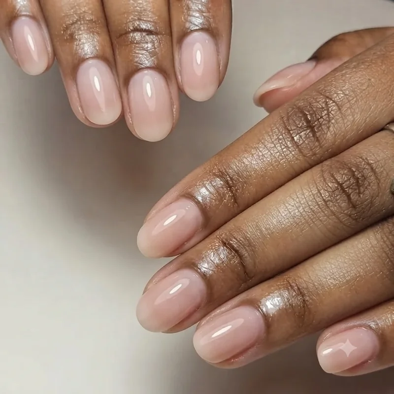 Close up of round nail shape manicure showing the natural curved fingertip edge