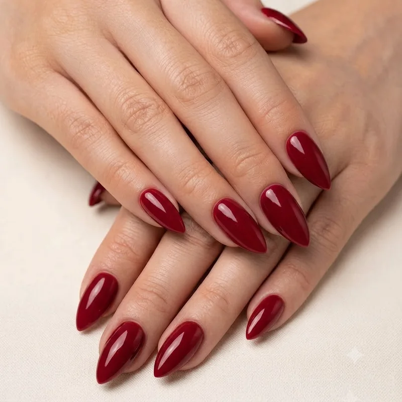 Close up of stiletto nail shape manicure with sharp tapered point at long length