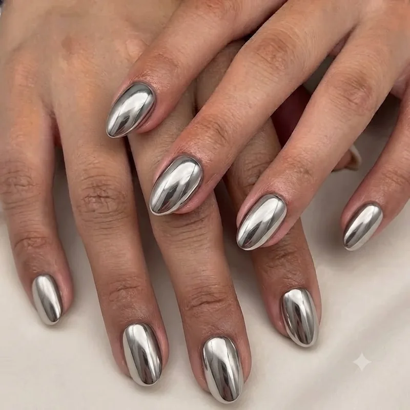 Chrome metallic finish on short stiletto nails showing 2026 trending manicure design