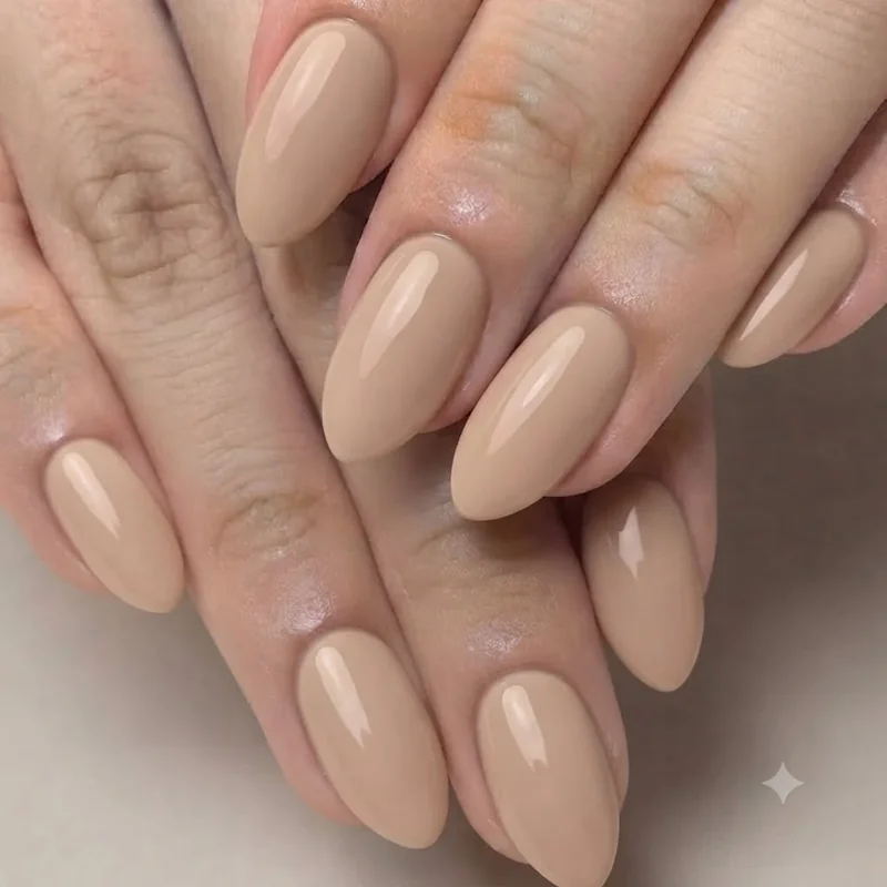 Classic short stiletto manicure in neutral tone showing the practical 2026 wearable length