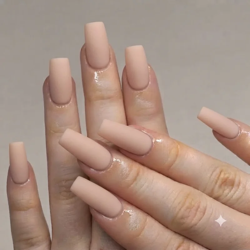 Short natural squoval nails with minimal polish showing an achievable at-home filing result