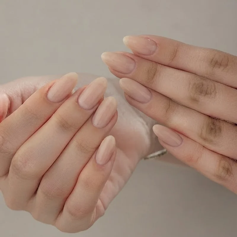 Healthy, well-maintained short natural gel overlay nails emphasizing nail strength and health in between regular salon fills