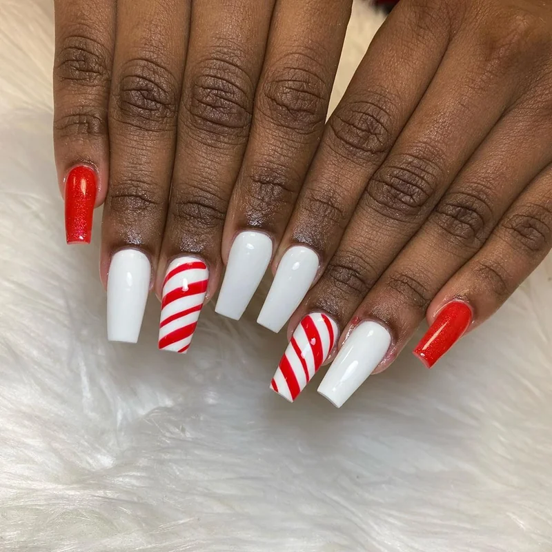 Modern negative space candy cane nails with bare nail showing through striped design