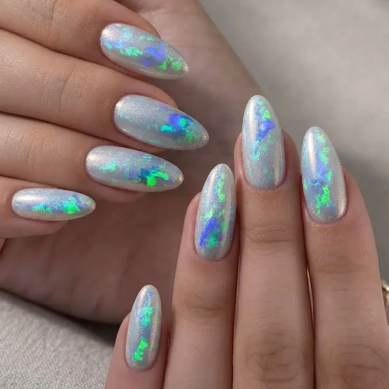 Bold precious opal chrome nail set flashing blue green and violet in changing light angles