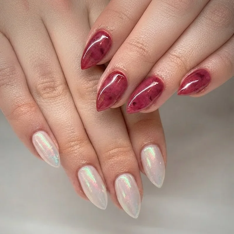 Side by side opal iridescent manicure and pink tourmaline manicure on matching almond shape