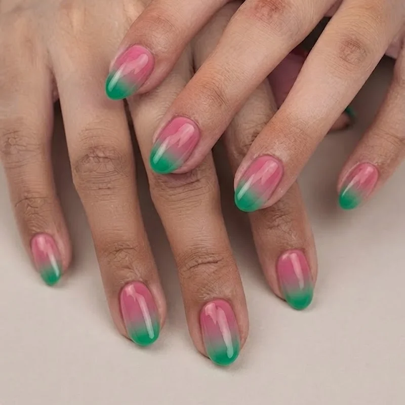 Watermelon tourmaline inspired manicure with pink center and green outer gradient nail design