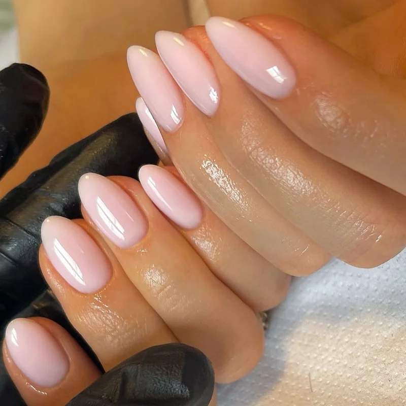 Oval and almond nail shapes comparison on aging hands demonstrating finger-elongating flattering effect