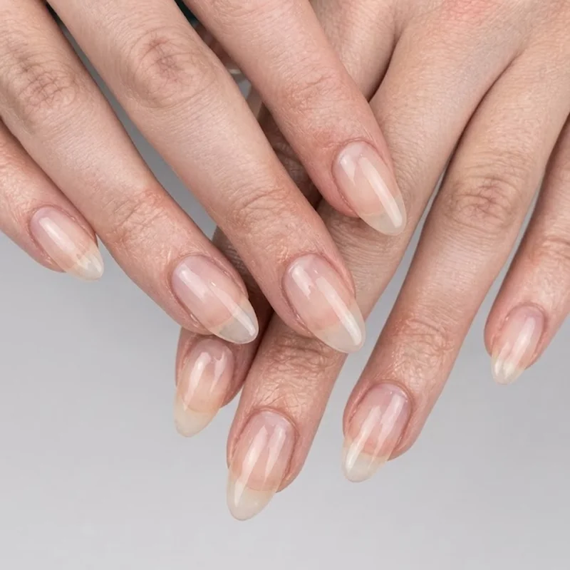 Finished symmetrical oval nail set showing even taper and shape across all fingers